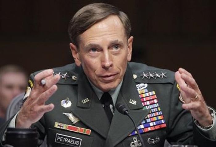 U.S. General David Petraeus gestures during the Senate Intellig