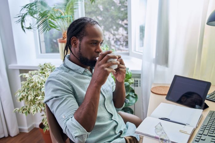 man_at_monitor_shutterstock_2083335898-1