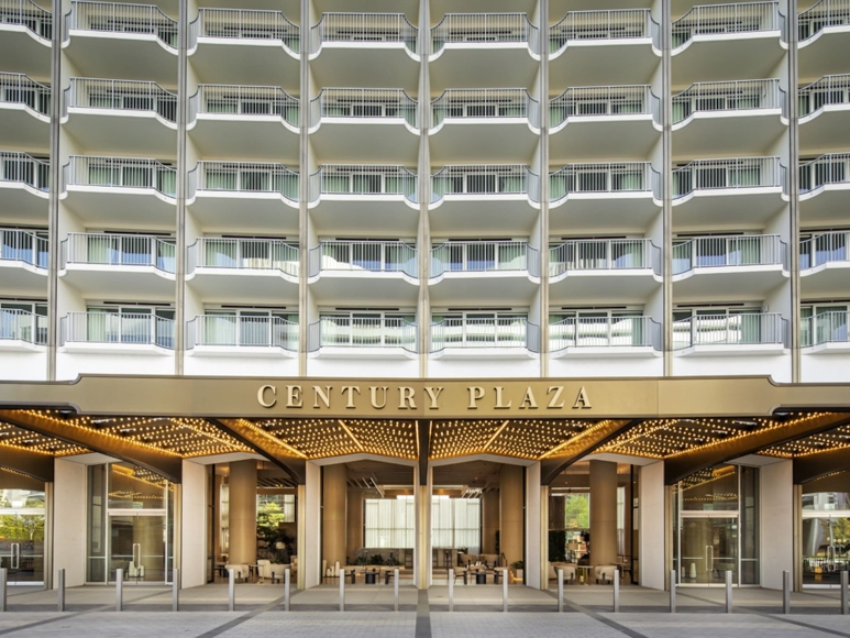 Entrance of the Hyatt Regency Century Plaza featuring a modern façade and outdoor seating area.