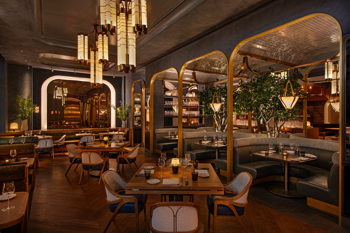 Sophisticated dining atmosphere at Bourbon Steak New York, featuring elegant lighting and stylish seating arrangements.