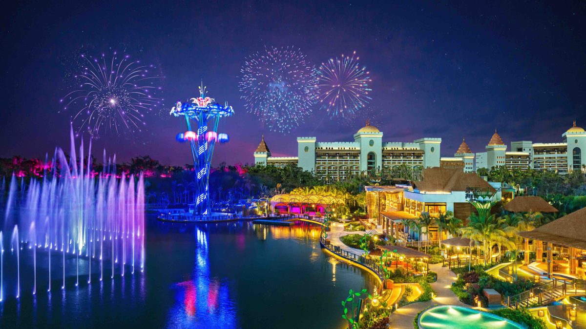 Colorful fireworks illuminate the night sky above VidantaWorld in Nuevo Vallarta, featuring vibrant lighting and scenic landscapes.