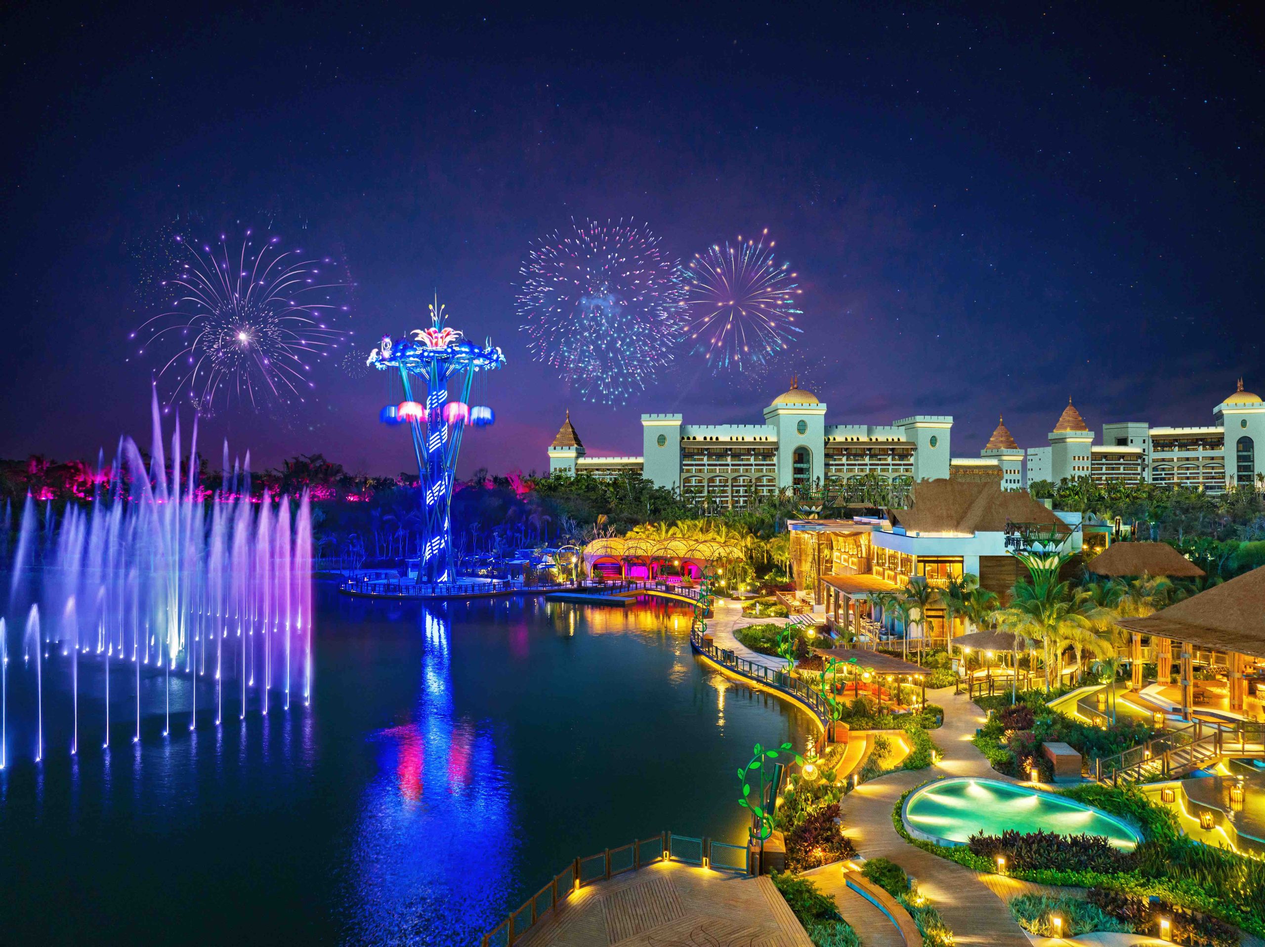 Colorful fireworks illuminate the night sky above VidantaWorld in Nuevo Vallarta, featuring vibrant lighting and scenic landscapes.
