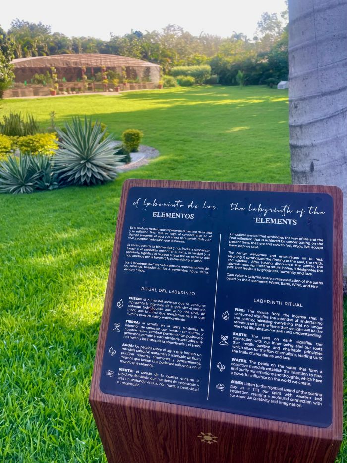 Sign describing the Labyrinth of Elements at Velas Resorts, featuring rituals related to water, earth, fire, and air.