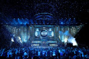 Confetti fills the air as a large crowd celebrates the inaugural America Business Forum in Miami.
