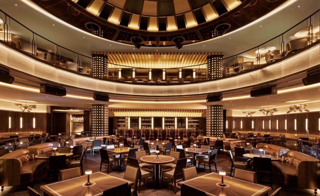 Stylish interior of a restaurant at Hard Rock Hotel New York, featuring elegant seating and ambient lighting.