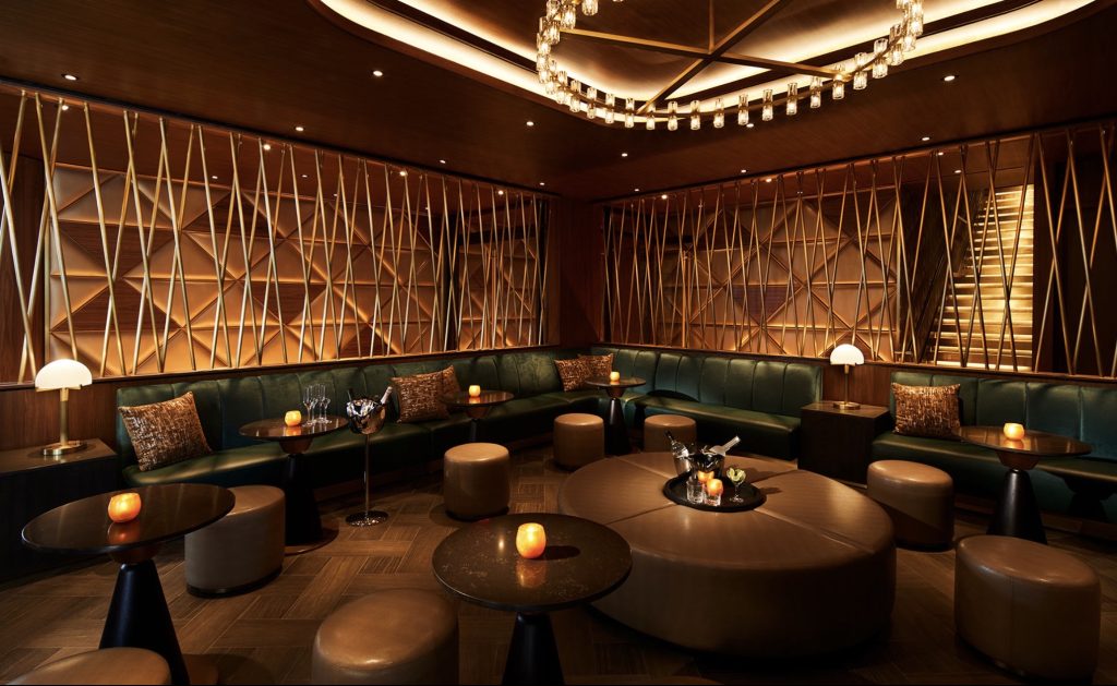 Stylish lounge area at Hard Rock Hotel New York featuring plush seating, elegant lighting, and modern decor.