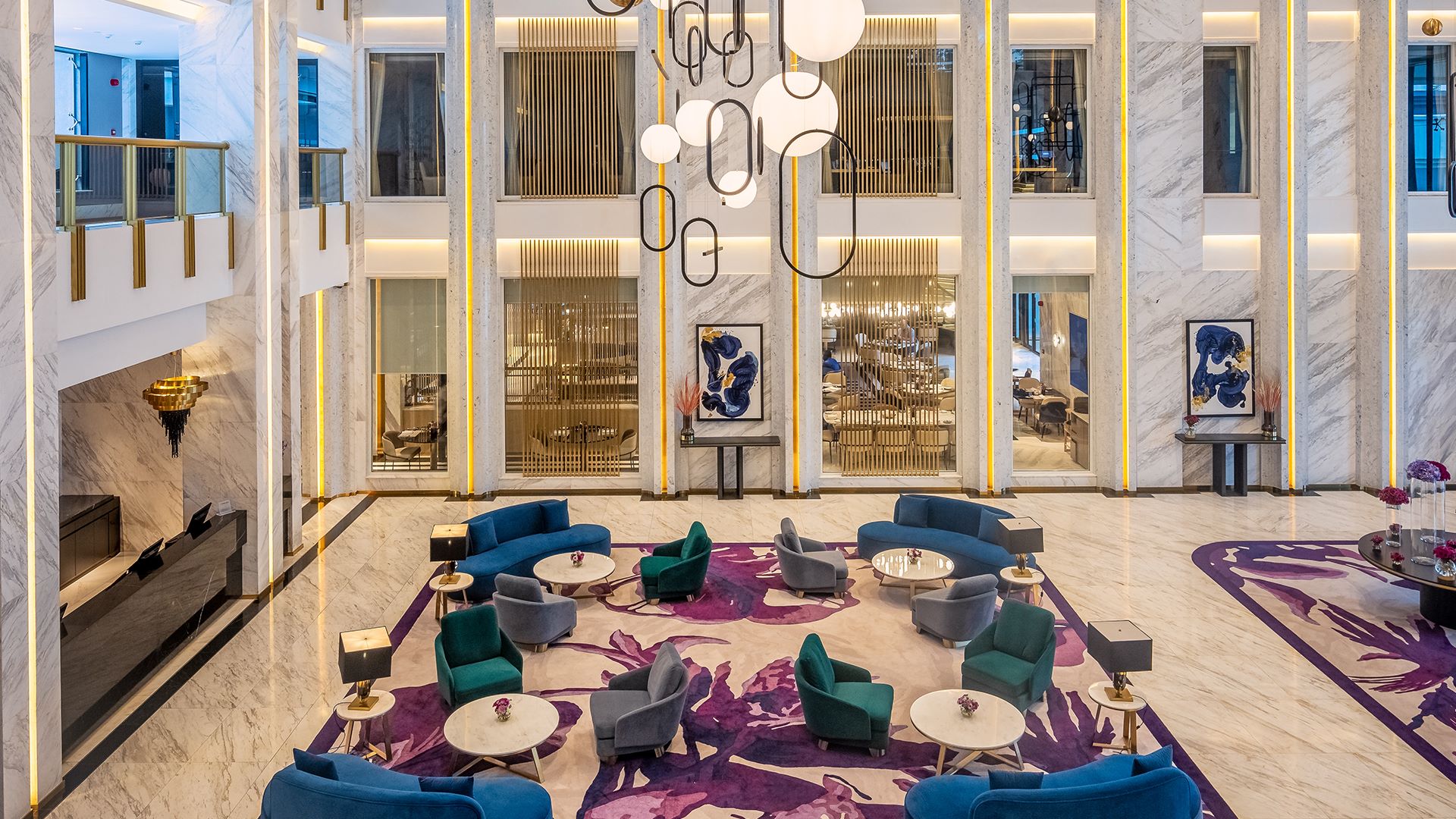 Elegant lobby featuring modern furnishings, marble accents, and warm lighting at Glee Nairobi, an award-winning luxury venue.