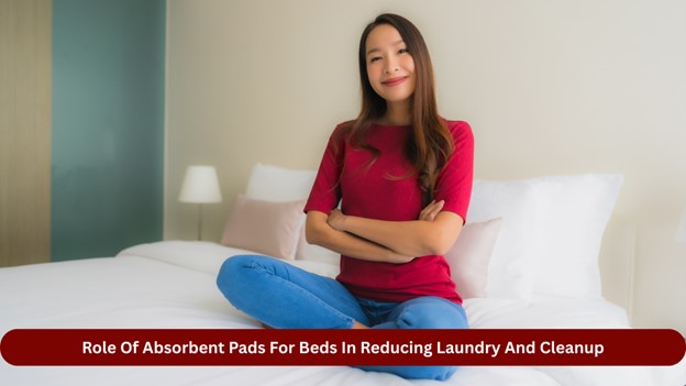 Woman sitting cross-legged on a bed, smiling, promoting the benefits of absorbent pads for reducing laundry and cleanup.