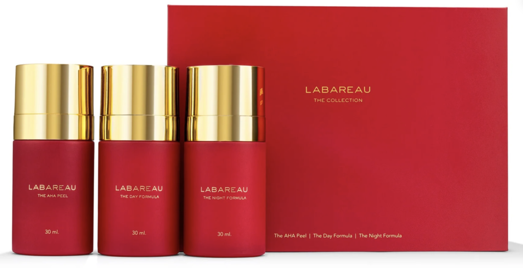 Luxurious red skincare set from Labareau, featuring AHA Peel, Day Formula, and Night Formula in elegant packaging.