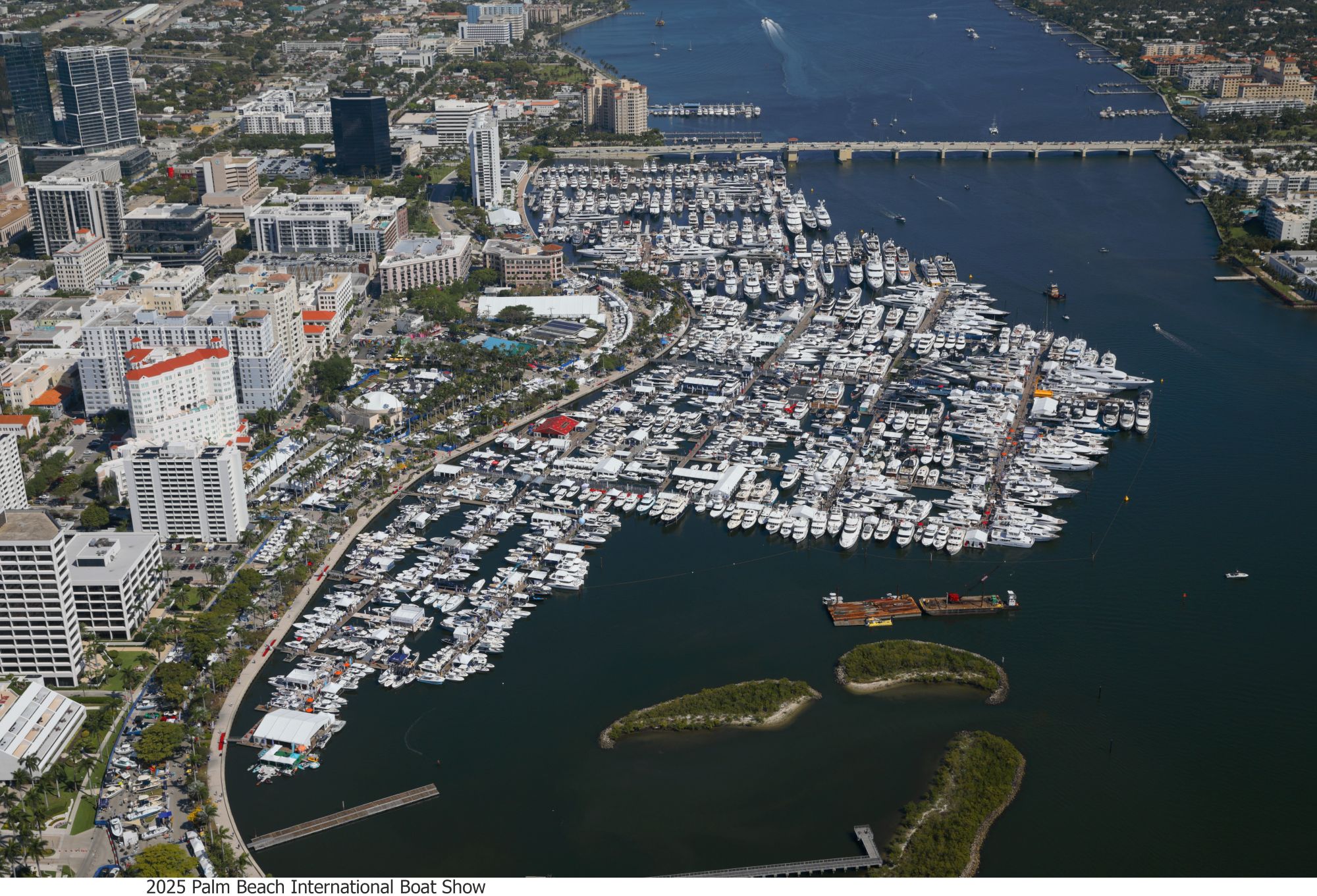Aerial view of the Palm Beach International Boat Show showcasing numerous yachts docked along the waterfront.