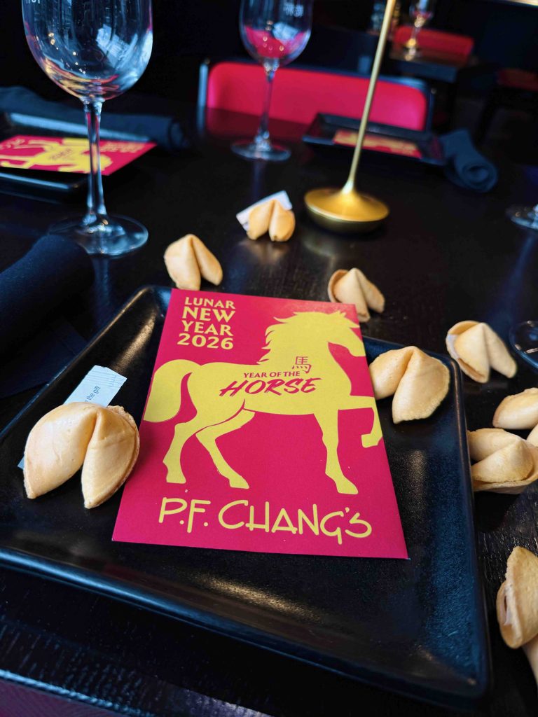 P.F. Chang's Lunar New Year celebration features a colorful card for the Year of the Horse surrounded by fortune cookies.