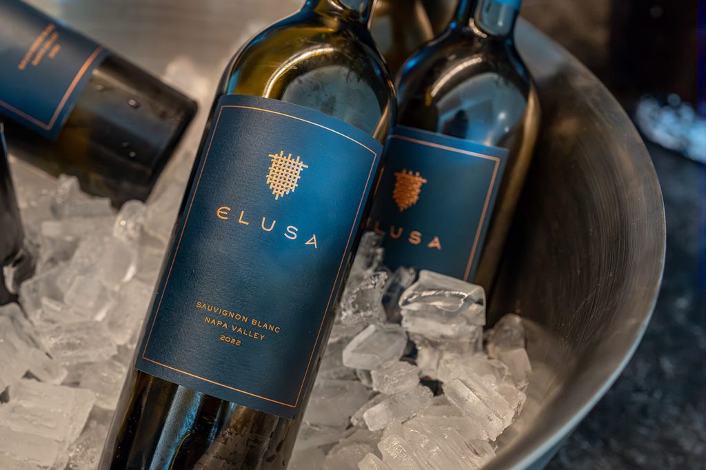 Elusa Winery Sauvignon Blanc bottles on ice, highlighting the 2022 Napa Valley vintage.