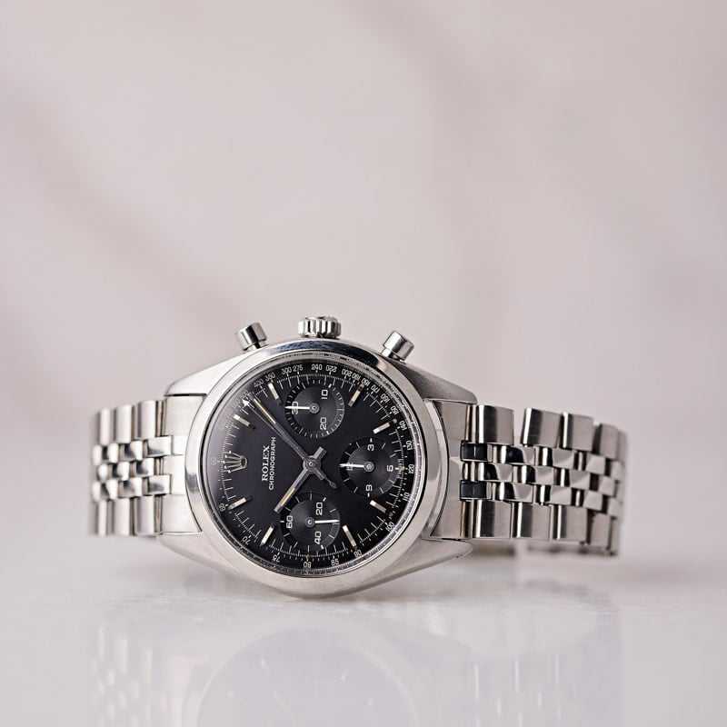 Vintage Rolex chronograph Pre-Daytona Ref. 6238 with black dial and stainless steel bracelet. Ideal for collectors and enthusiasts.