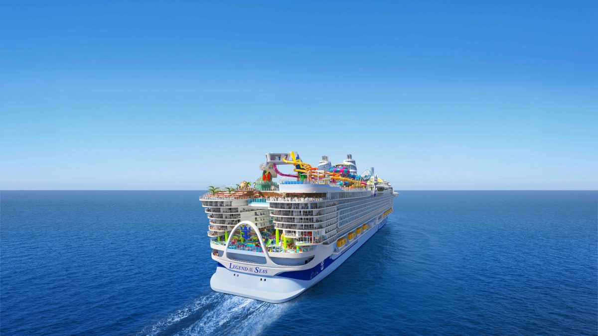 Legend of the Seas cruise ship sailing on clear blue waters, featuring vibrant deck attractions and dining areas.