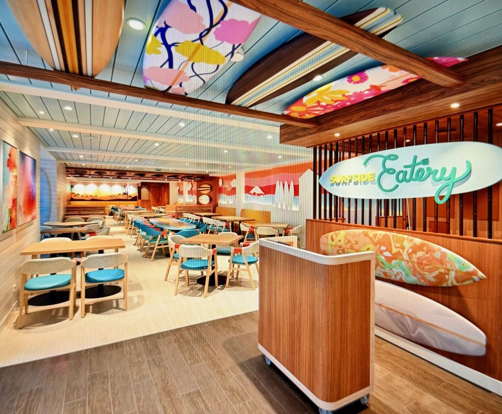 Colorful dining area of the Surfsid Eatery on the Legend of the Seas, featuring surfboard decor and modern seating arrangements.