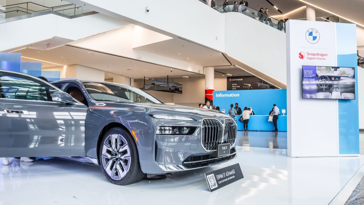 BMW luxury sedan on display at an event, showcasing futuristic design and technology for the 2026 EV lineup.