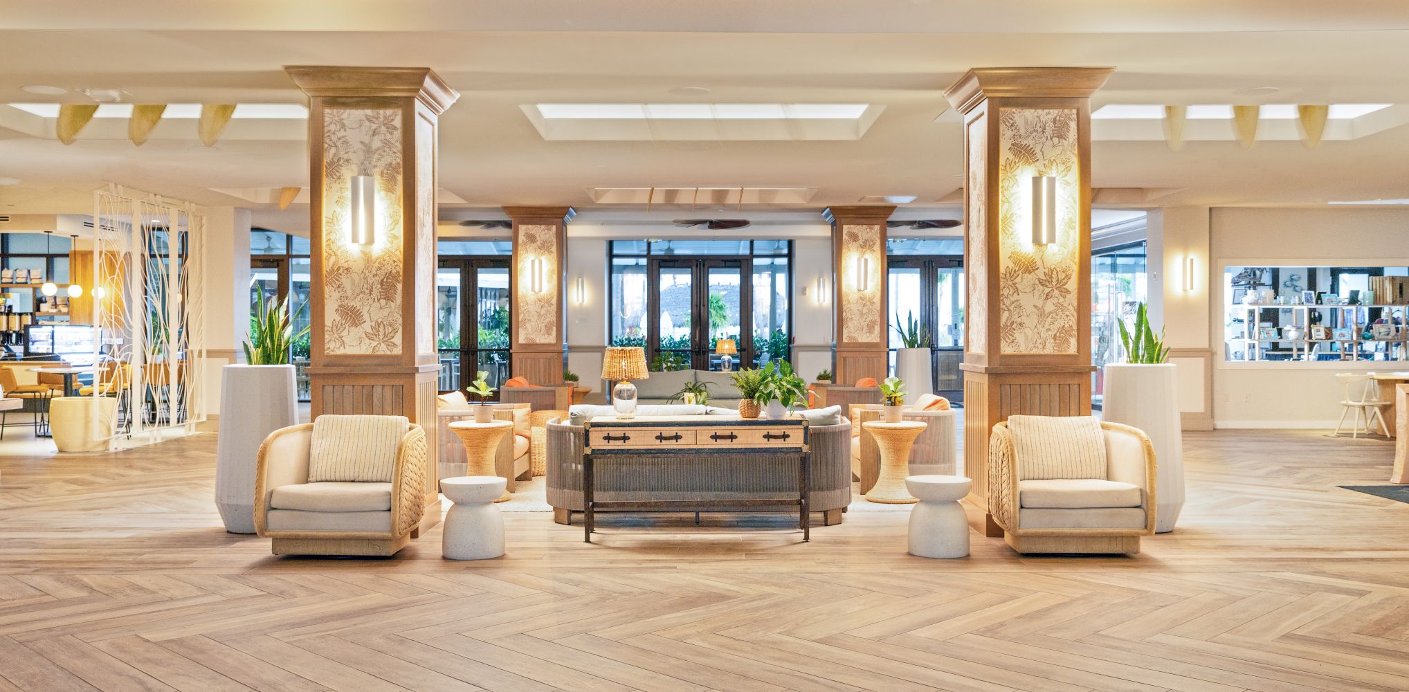 Elegant lobby of Hawks Cay Resort featuring comfortable seating, large windows, and tropical plants.