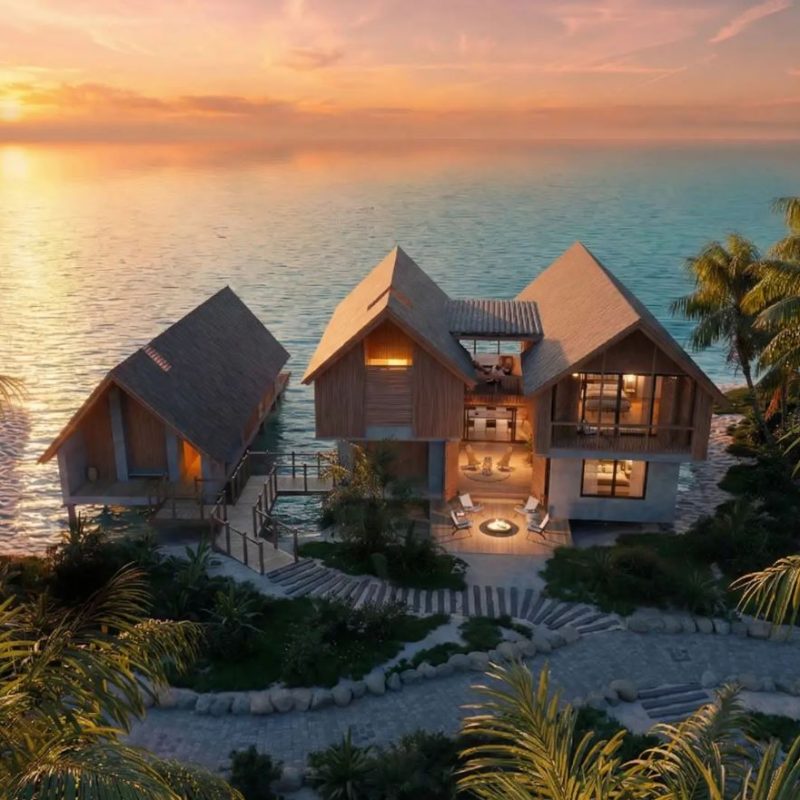 Branded residences by the ocean, featuring modern architecture and sunset views, surrounded by lush tropical landscaping.