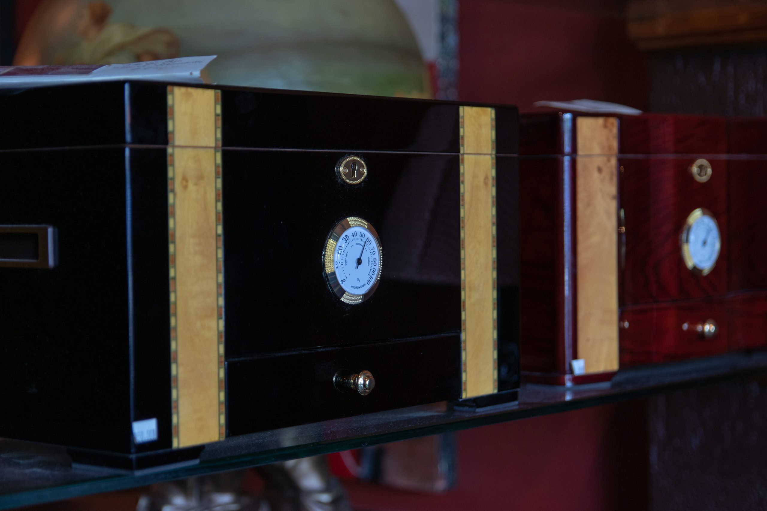 Elegant cigar humidors displayed in a luxury setting, showcasing craftsmanship and premium accessories for the ultimate lounge experience.