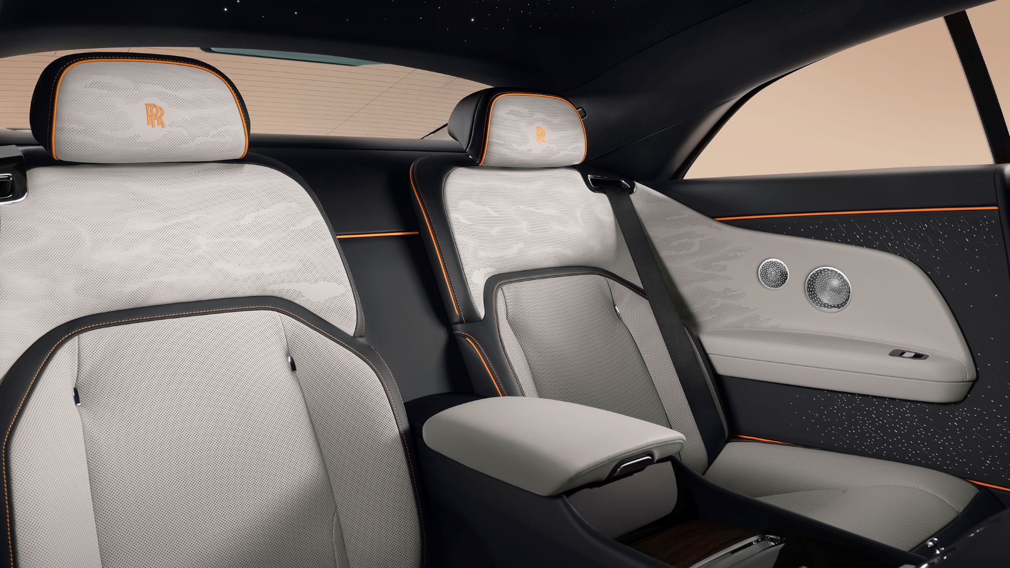 Luxurious rear seats of the Rolls-Royce Spectre Series II, featuring premium materials and bespoke design elements.