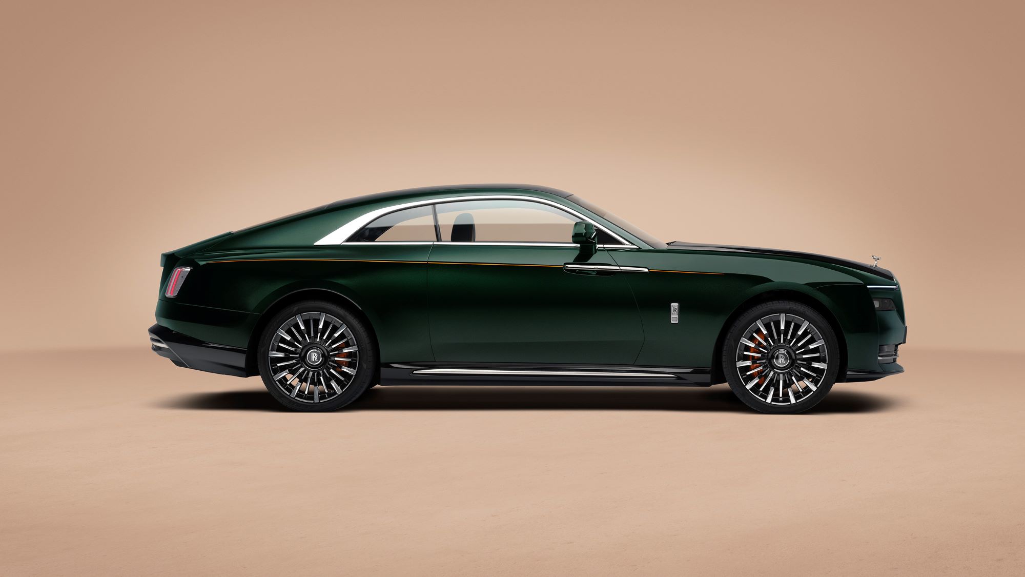 Rolls-Royce Spectre Series II in a deep green finish, showcasing sleek lines and luxurious design elements.