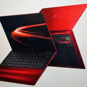 Luxury HP limited edition Scuderia Ferrari AI PC in vibrant red with an open display showing sleek design and keyboard.
