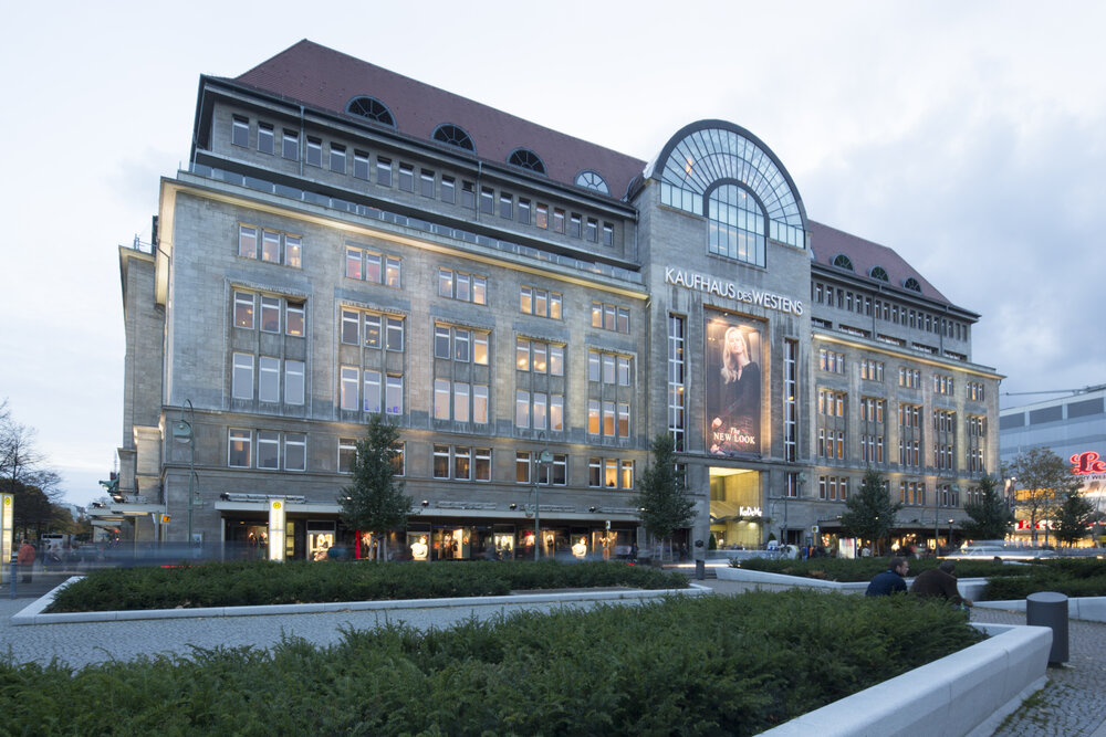 Kaufhaus des Westens, a historic department store in Berlin, featuring modern architecture and vibrant storefronts.