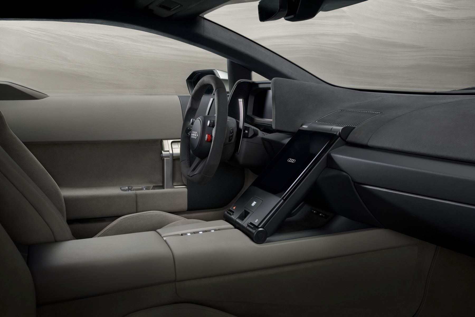 Interior view of the Audi Nuvolari supercar, highlighting the steering wheel and advanced dashboard design.