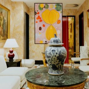 Elegant waiting area at Dr. David Jack, featuring artwork, a decorative vase, and stylish seating for clients.