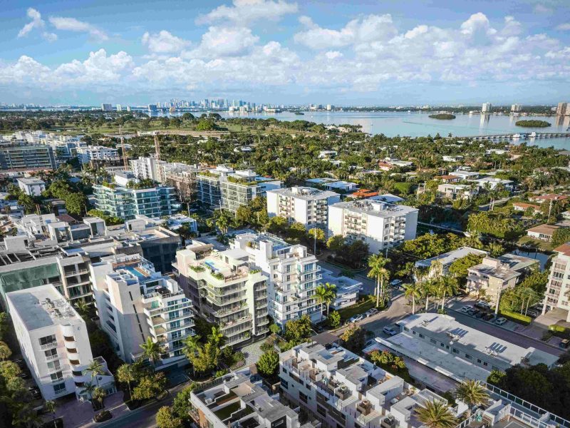 Aerial view of Bay Harbor Islands showcasing modern architecture and greenery, highlighting the new penthouse's location.