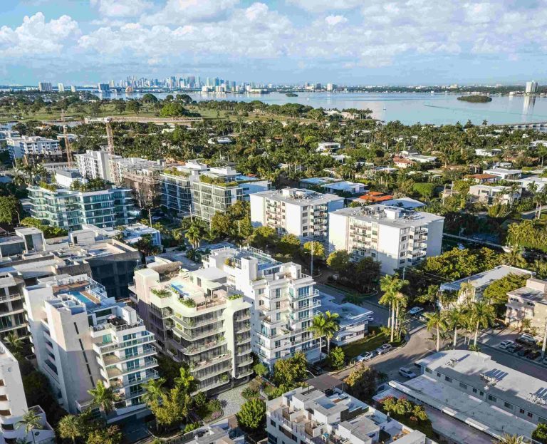 Aerial view of Bay Harbor Islands showcasing modern architecture and greenery, highlighting the new penthouse's location.