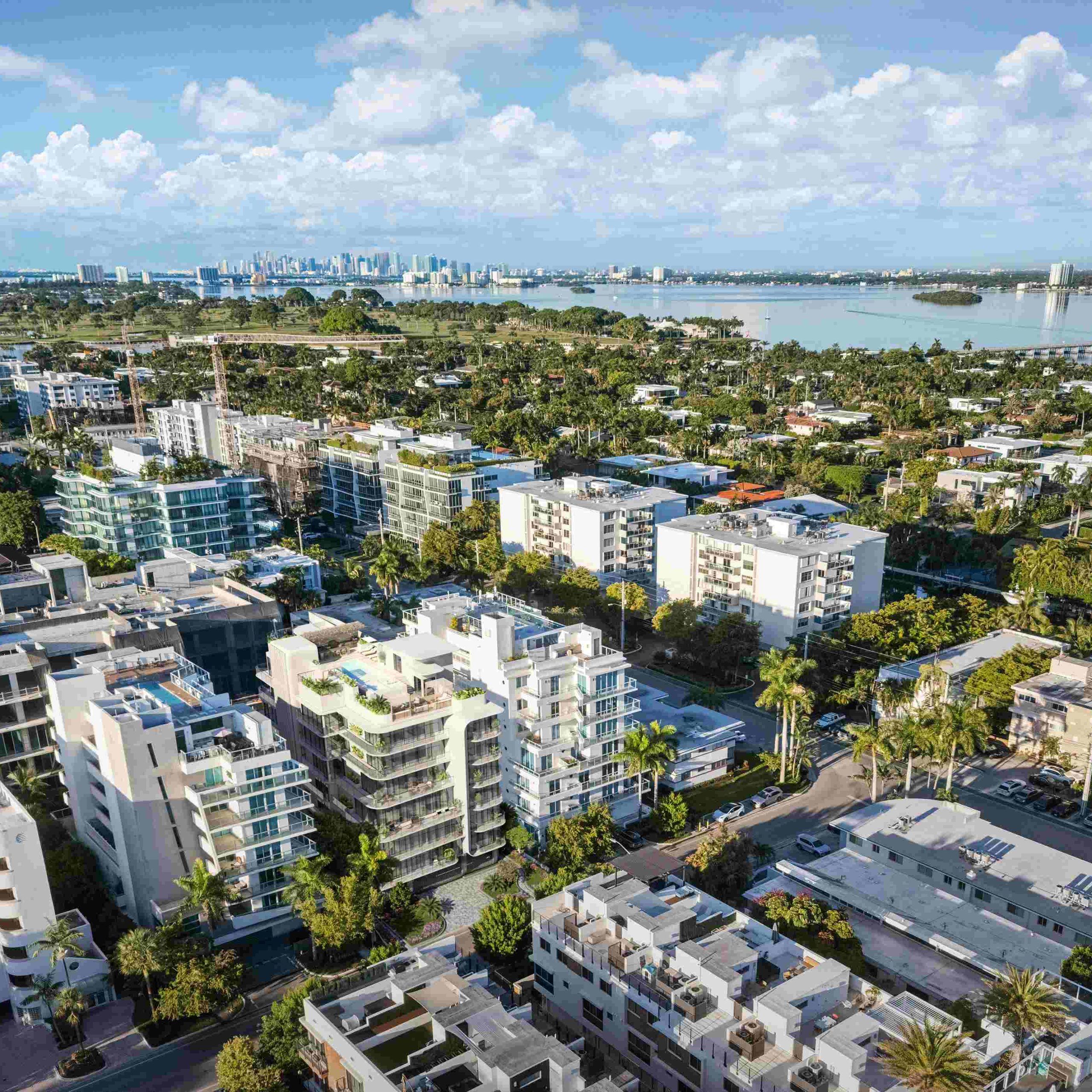 Aerial view of Bay Harbor Islands showcasing modern architecture and greenery, highlighting the new penthouse's location.