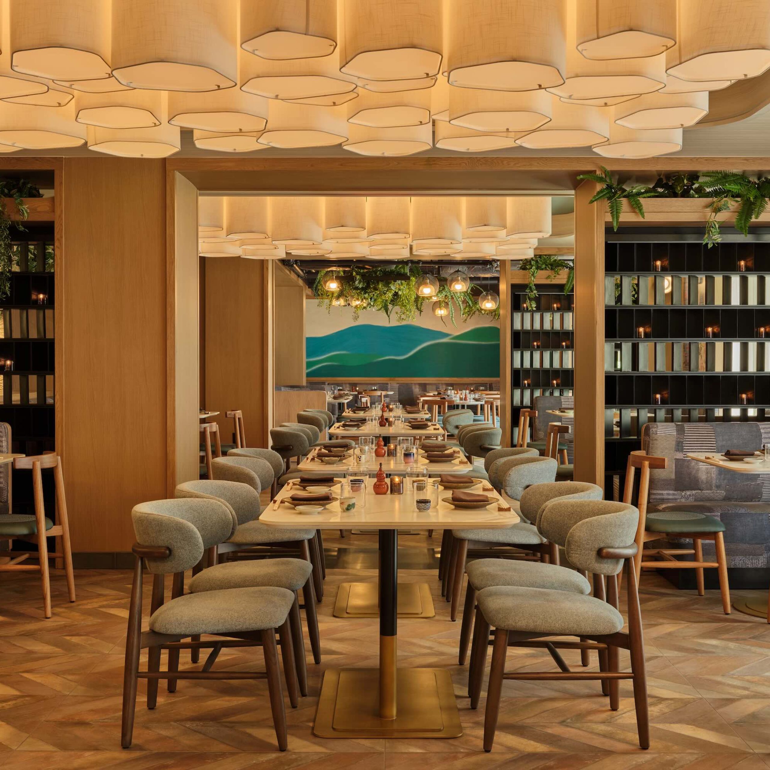 Modern dining area at 855-ALOHA with stylish furniture, soft lighting, and an inviting atmosphere for guests.
