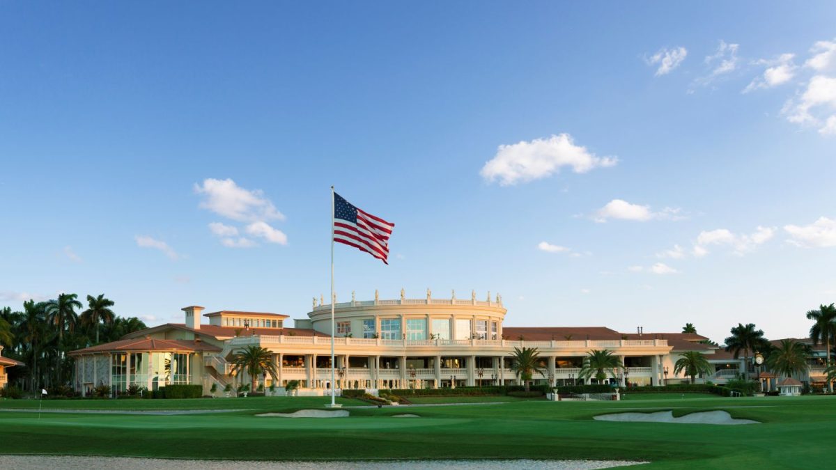 The iconic Trump Doral resort with the American flag, showcasing luxury golf course views and lush landscaping.