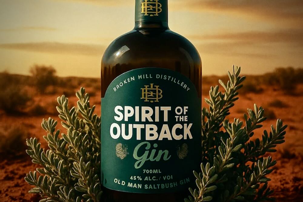 Old Man Saltbush gin bottle is placed on a desert landscape, celebrating World Gin Day with an earthy, natural aesthetic.