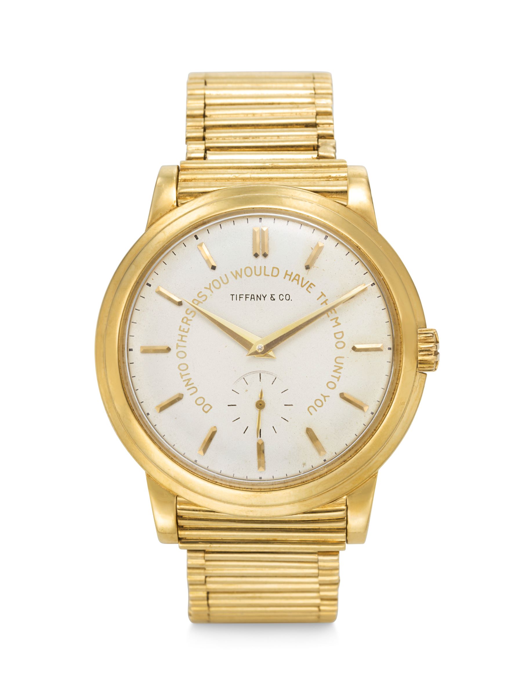 Gold Patek Philippe watch with a Tiffany & Co. dial, featuring a minimalist design and strap, showcased in a luxury auction.