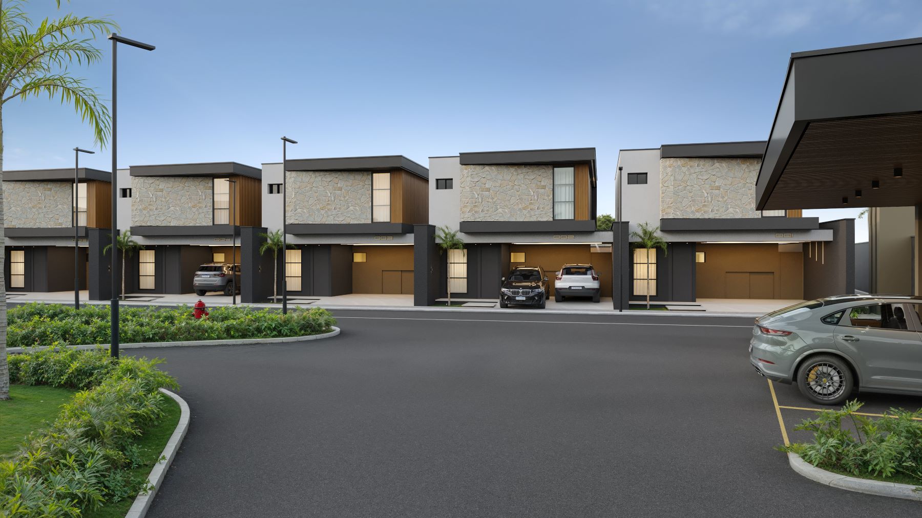 Modern residential buildings with landscaped surroundings and parked cars in Cayman.