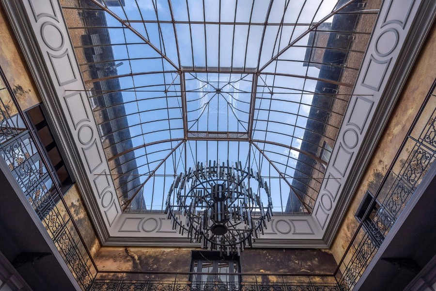 Iconic dome ceiling with a chandelier, showcasing the architectural elegance of Oatland Park Hotel.