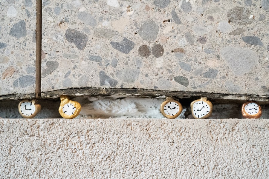 Decorative clocks embedded in the floor of the B5 Boutique Hotel Lugano, adding a unique artistic touch to the interior design.