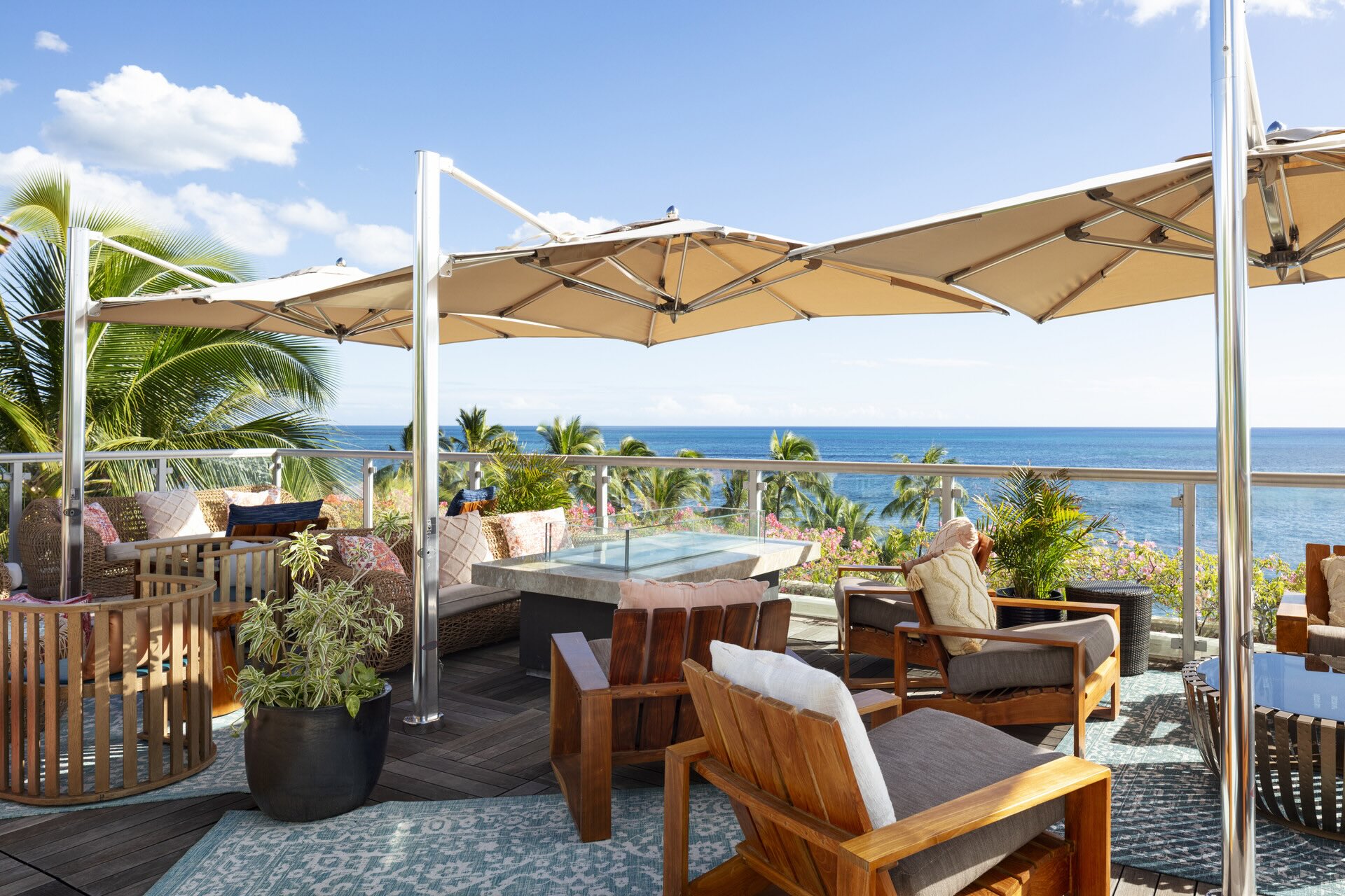 Cozy terrace lounge area with stylish seating and ocean views at Four Seasons Oʻahu at Ko Olina.