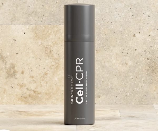 Gray bottle of SkinModerne Cell•CPR serum on a neutral stone background.