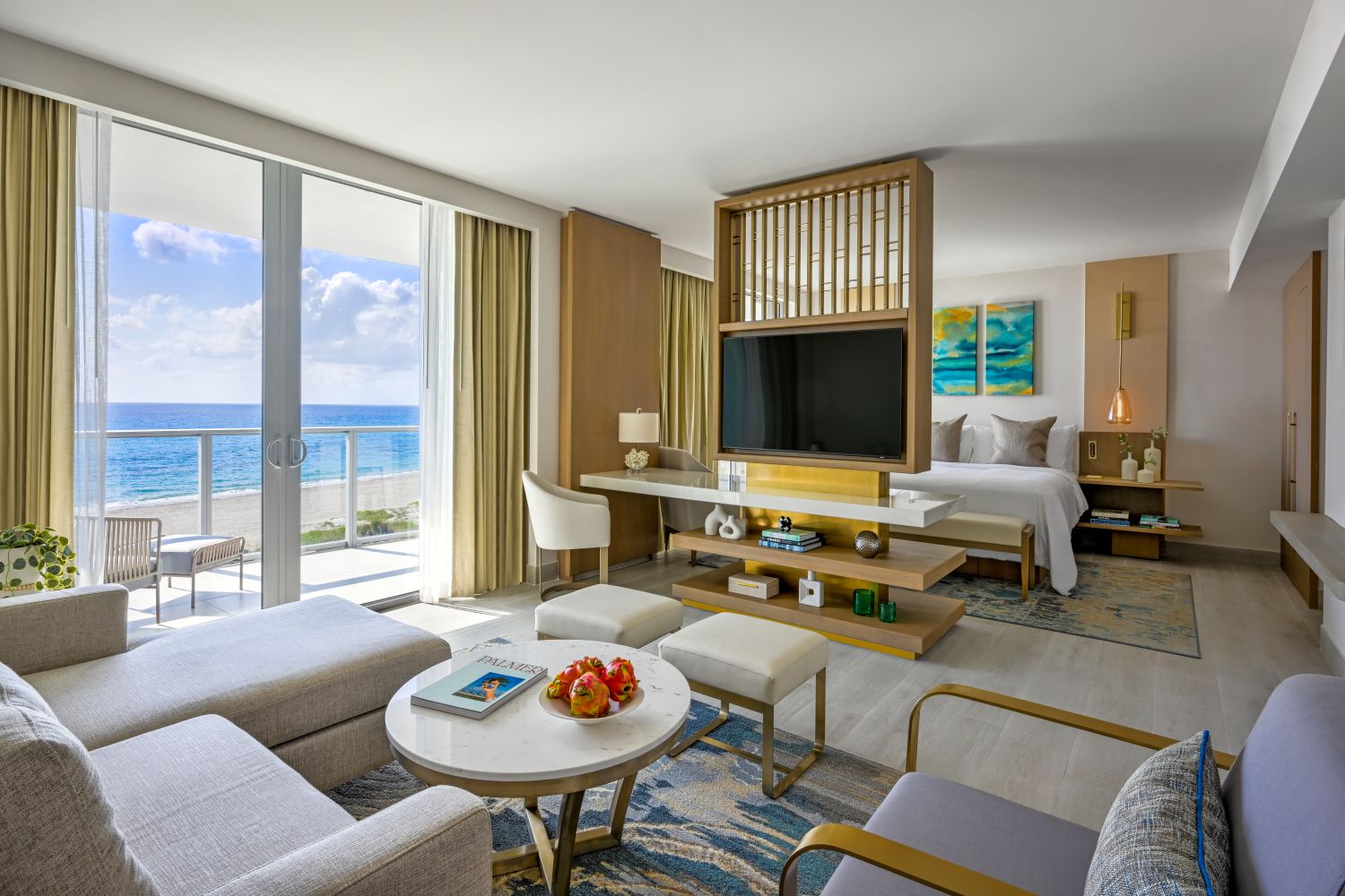 Modern guest room at Amrit Ocean Resort with ocean views, stylish furnishings, and a cozy ambiance for relaxation.