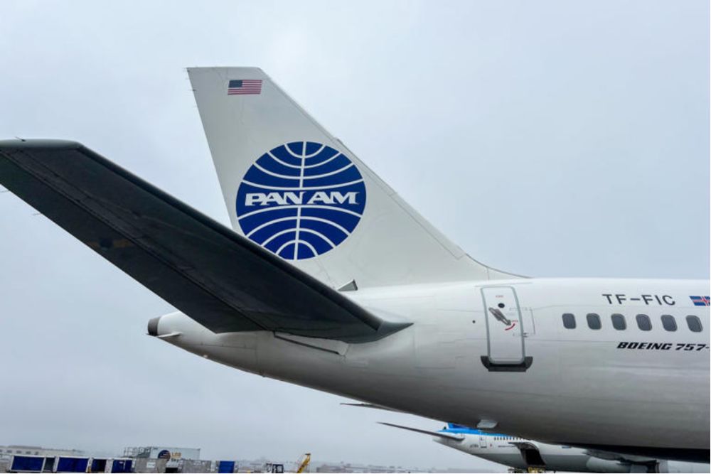 Pan Am aircraft tail featuring the iconic logo, symbolizing the airline's return with private jet expeditions.