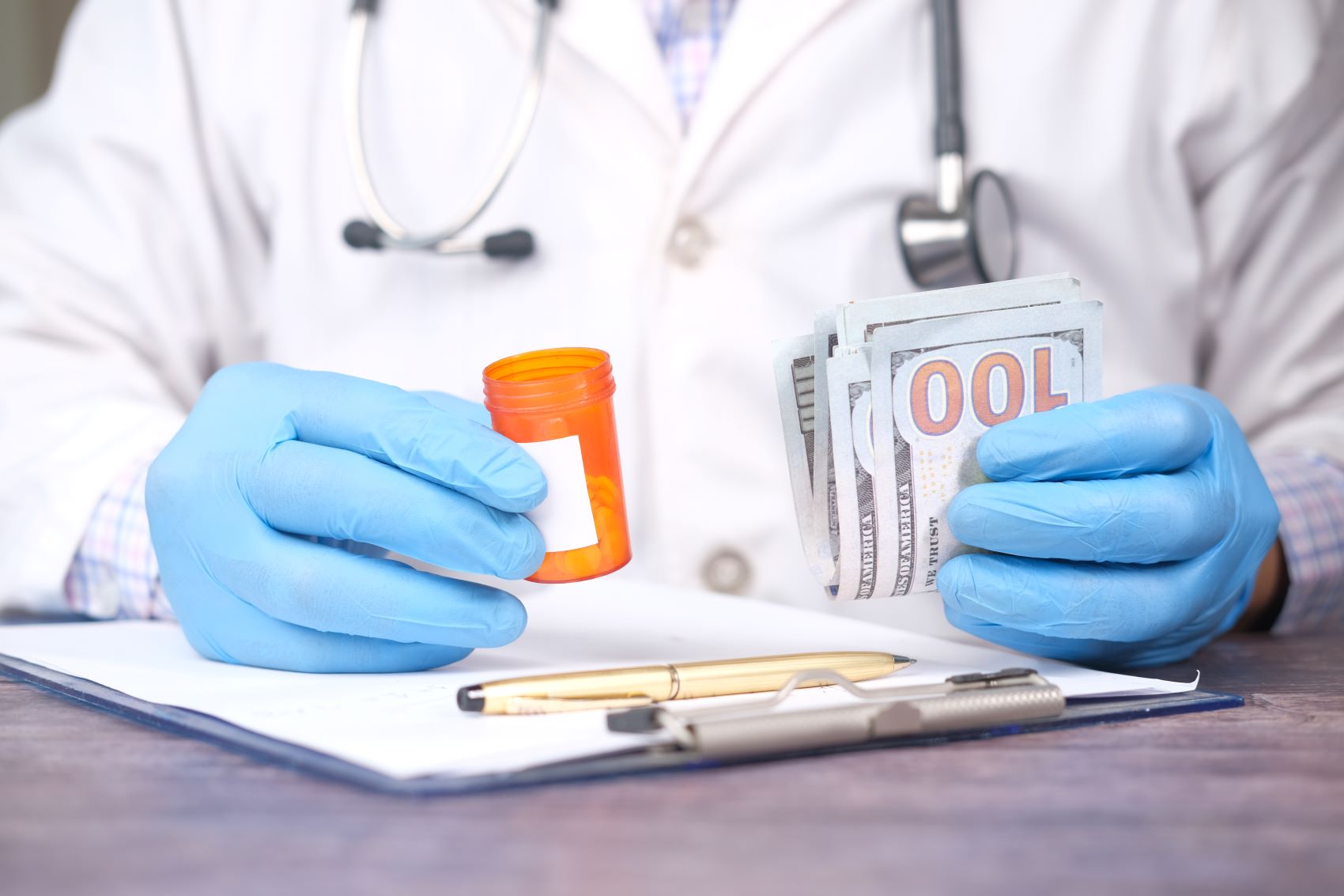 A doctor in blue gloves holds a prescription bottle and cash, representing financial steps after a car accident.