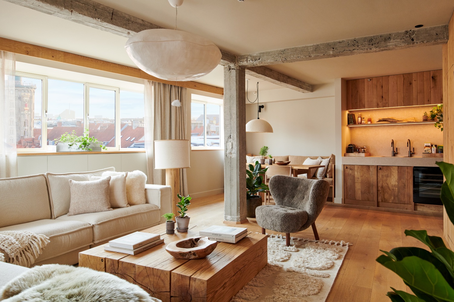 Stylish living space showcasing eco-friendly elements, featuring a cozy sofa, wooden furniture, and a bright, airy atmosphere.