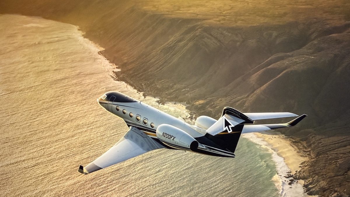 Flexjet's Gulfstream G500 jet flying over a coastal landscape during sunset, showcasing luxury and advanced design.