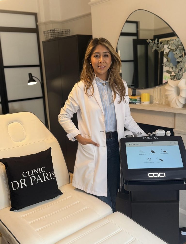 Dr. Paris stands beside the CACI Rejuva Med™ machine in a modern clinic setting, promoting high-tech facial treatments.