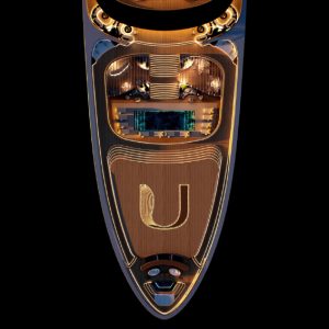 Top-down view of a luxurious yacht deck featuring elegant furniture and a central pool area.