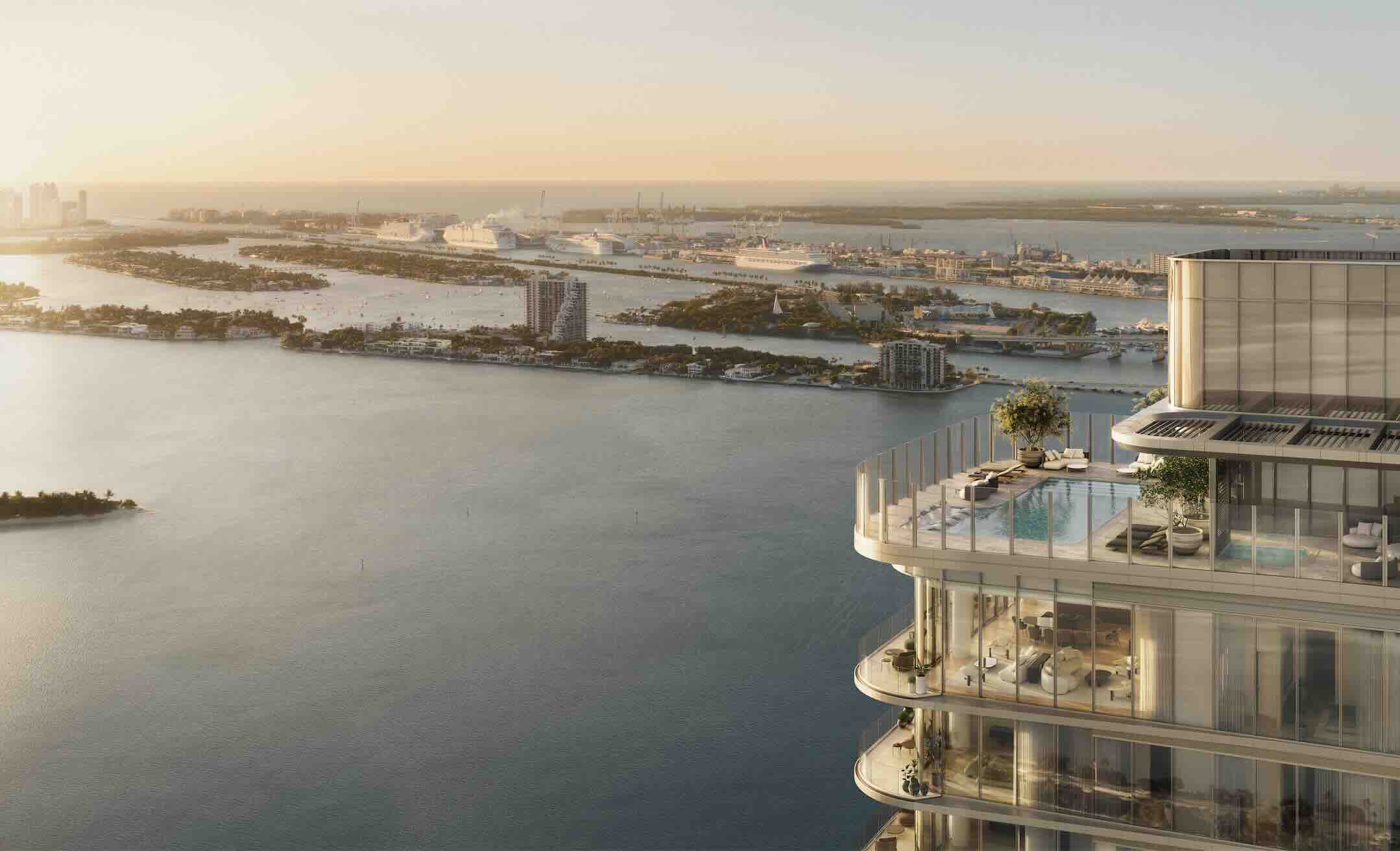 Luxury waterfront view from LILLI, featuring a modern building and the Miami skyline during sunset.