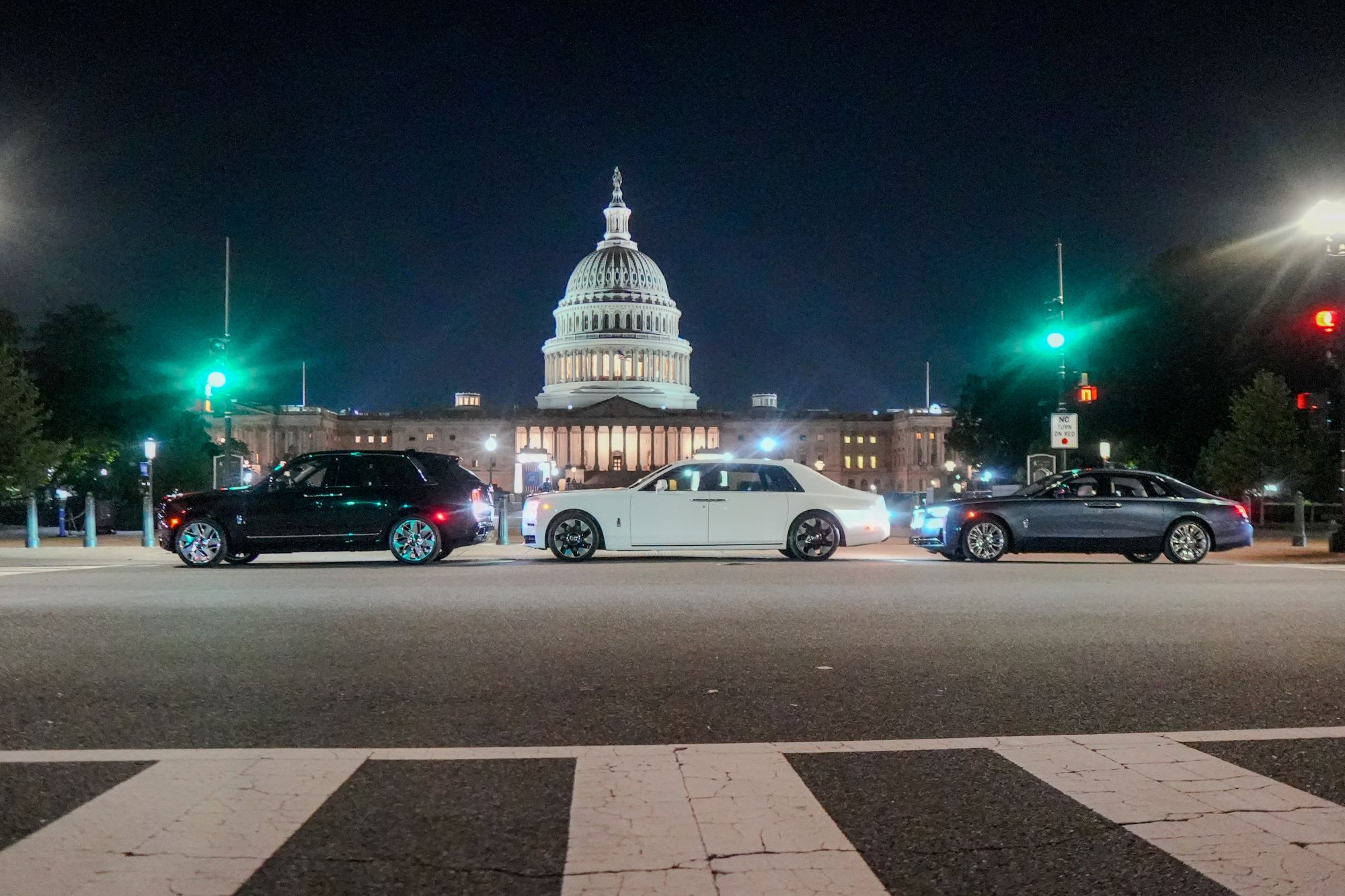 Three bespoke Rolls-Royce cars displayed at night in front of the U.S. Capitol, celebrating America's 250th anniversary.